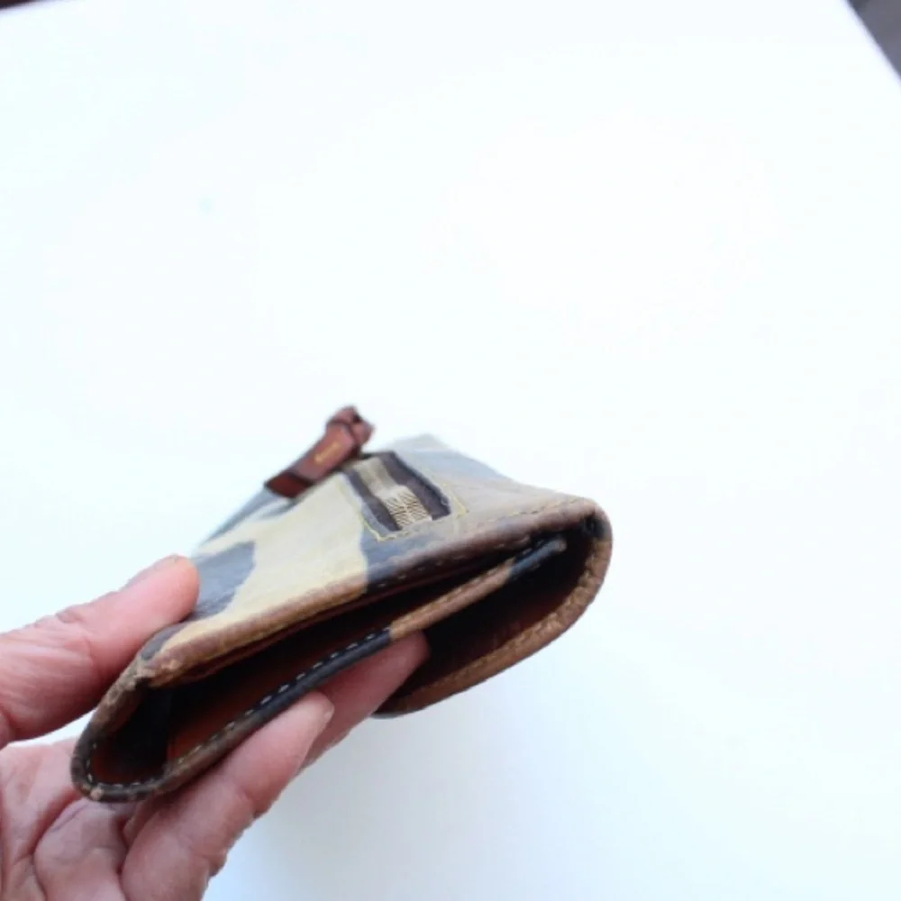 Vintage Dooney & Bourke wallet  featuring a zebra print on leather.